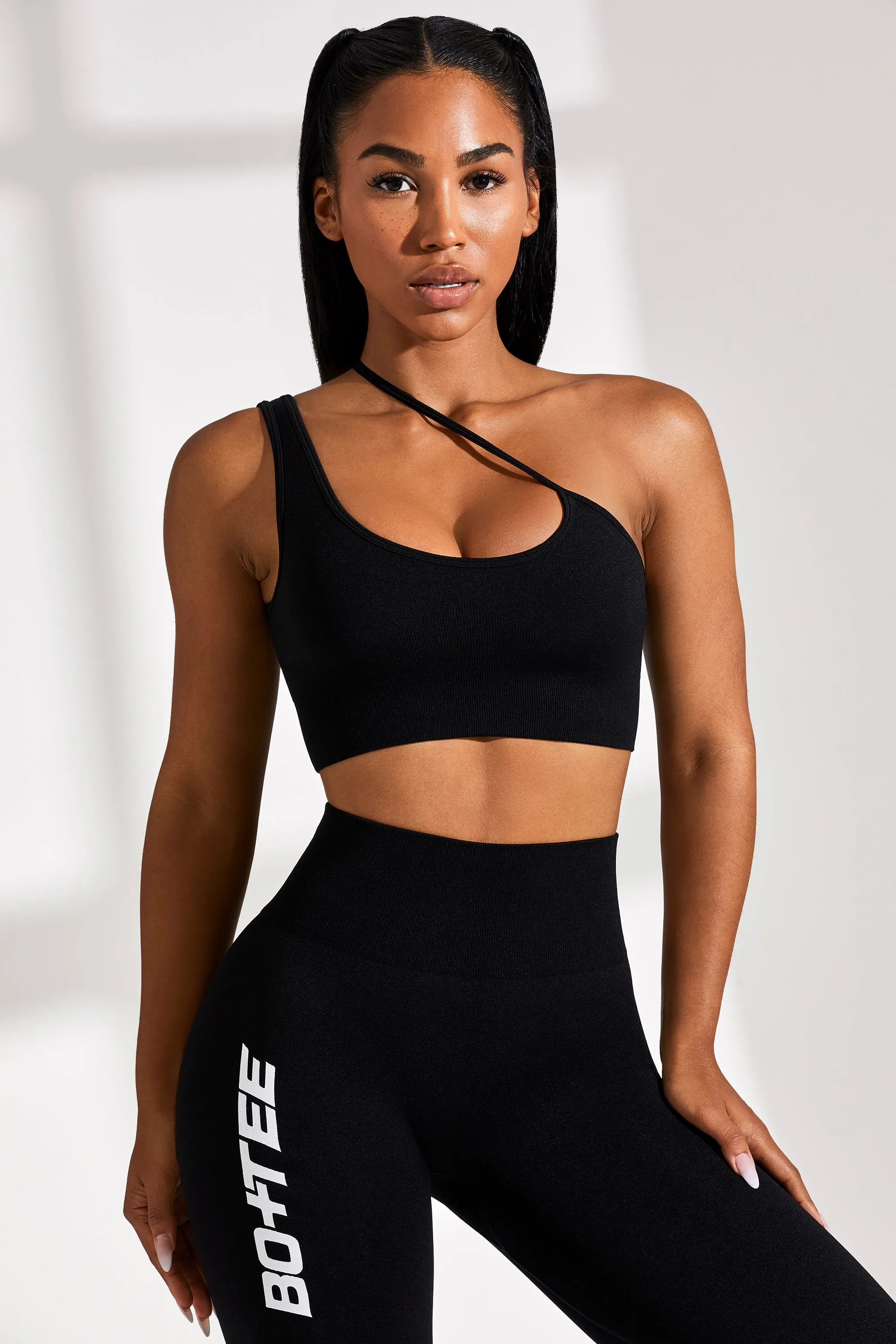Asymmetric Seamless Crop Top in Black sold by Oh Polly