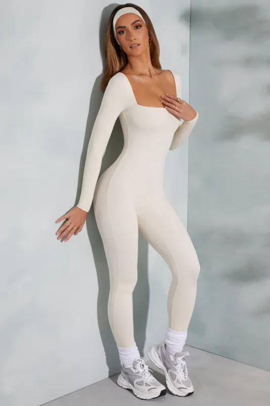 Petite Square Neck Long Sleeve Jumpsuit in Ivory sold by Oh Polly