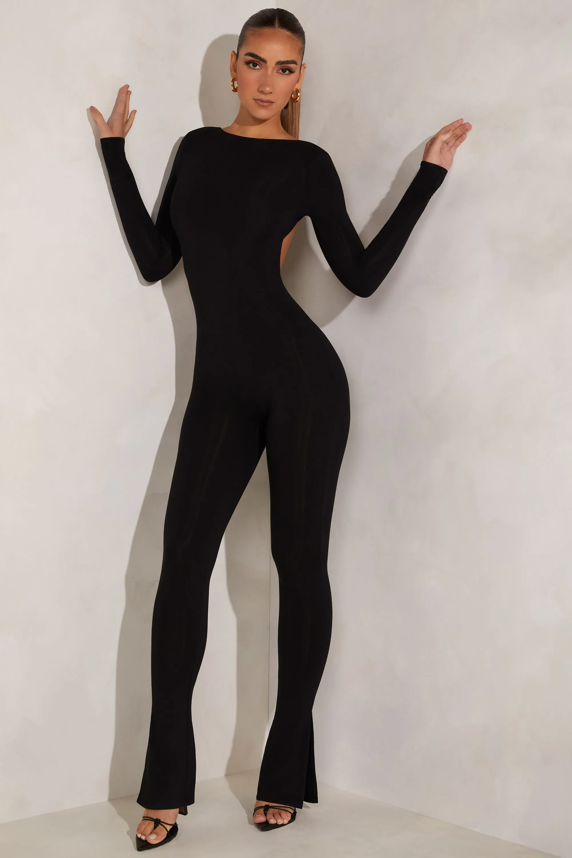 High Neck Open Back Jumpsuit in Black sold by Oh Polly