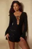 Long Sleeve Lace Up Mini Dress in Black sold by Oh Polly