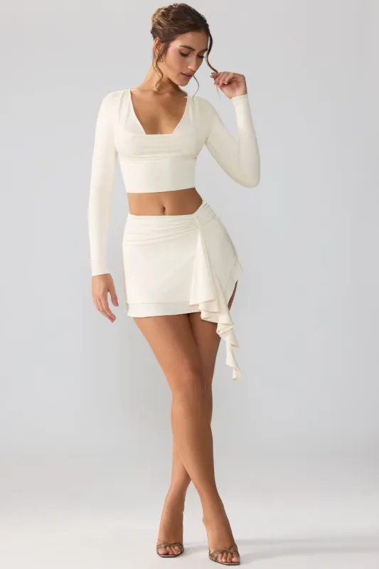 Slinky Jersey Mid Rise Ruffle Layer Mini Skirt in Ivory sold by Oh Polly