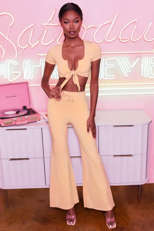 Laid Back Petite Wide Leg Trousers in Peach sold by Oh Polly