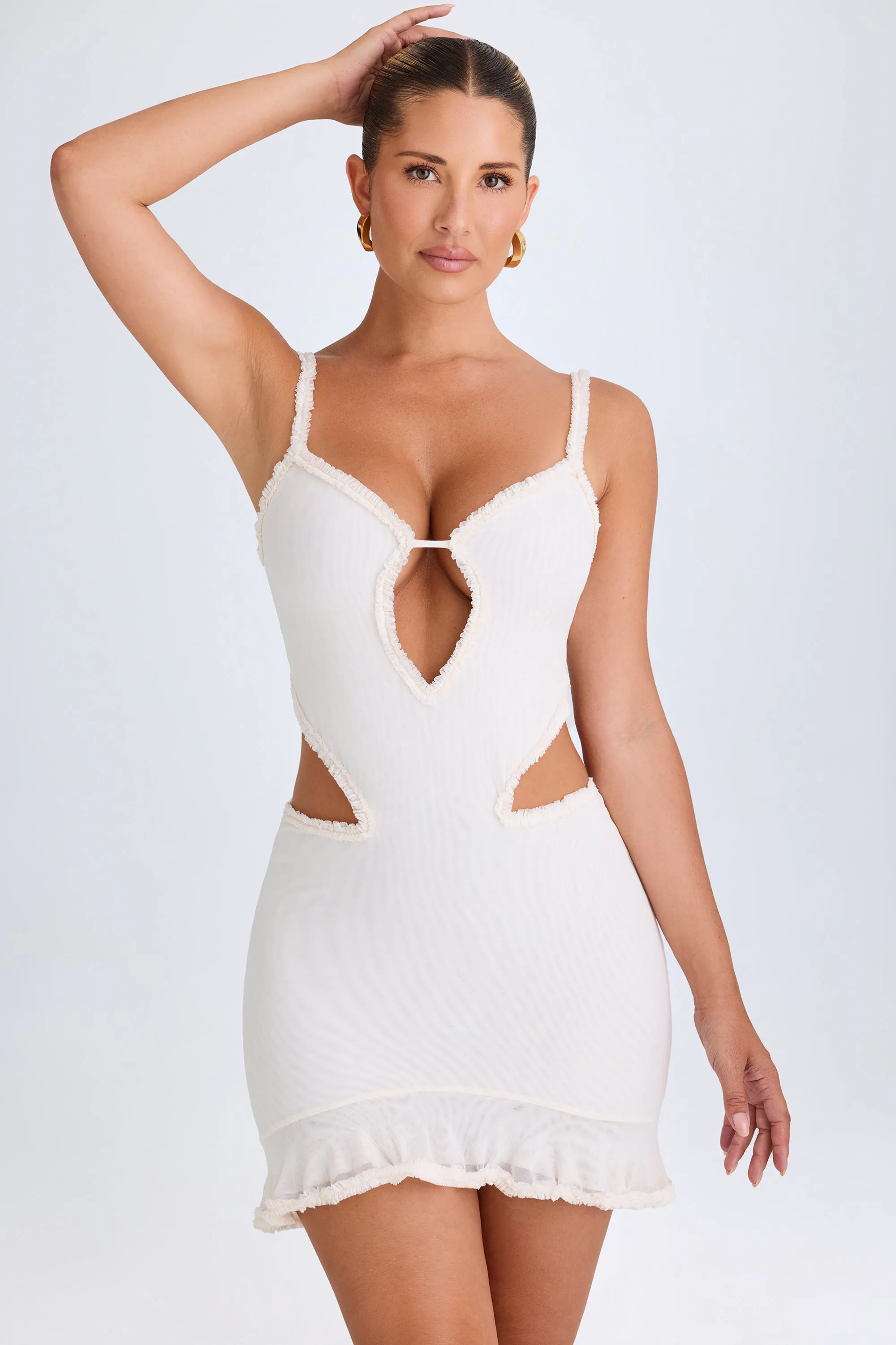 Ruffle-Appliqué Cut-Out Mini Dress in White sold by Oh Polly