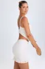 Ruffle-Appliqué Cut-Out Mini Dress in White sold by Oh Polly