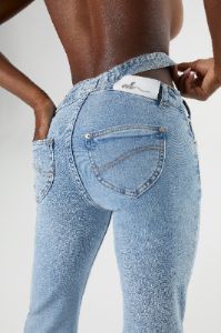 Mid Rise Flared Jeans in Medium Blue Wash sold by Oh Polly