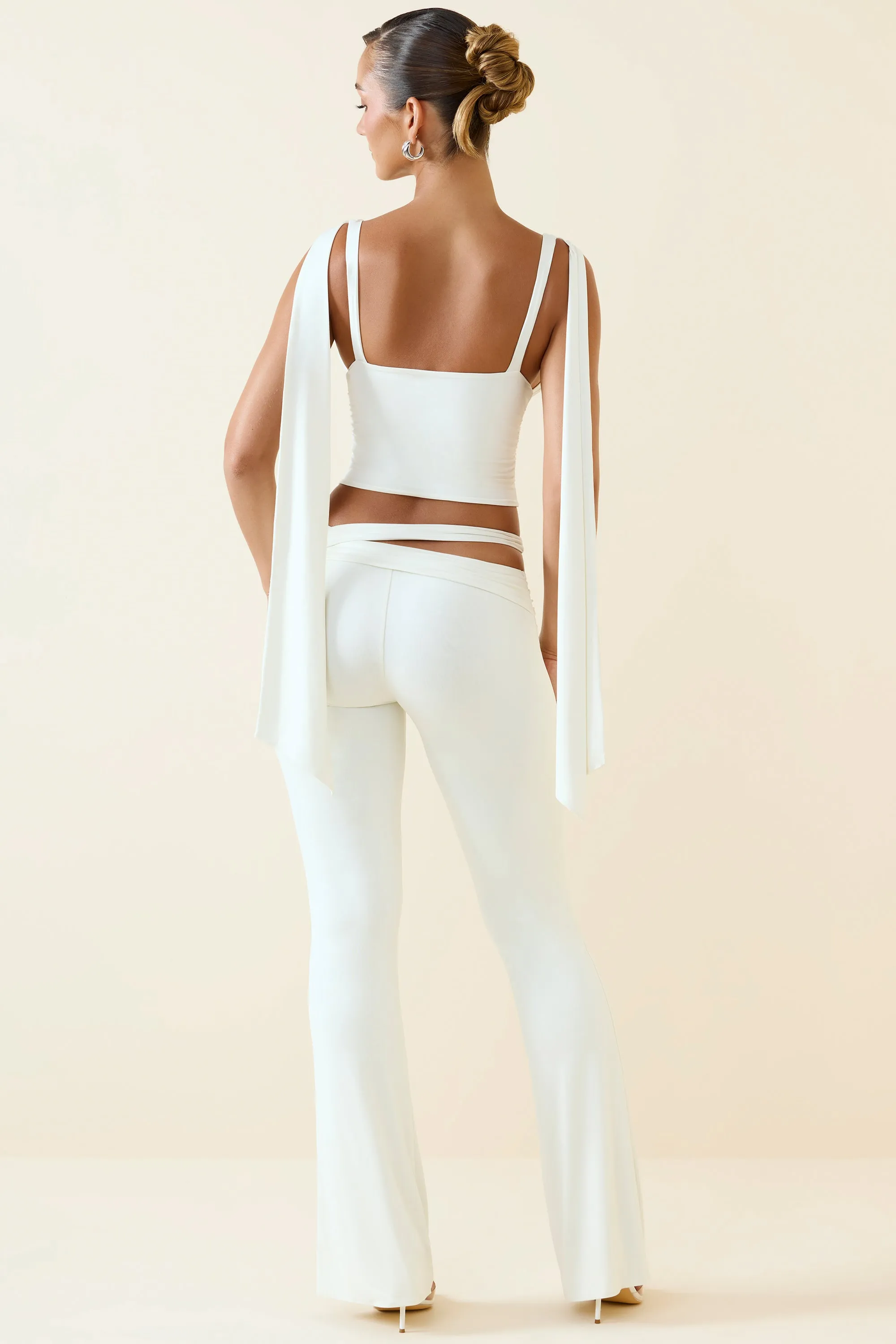 Tall Cut-Out Mid-Rise Flared Trousers in Vanilla sold by Oh Polly product image thumbnail 2