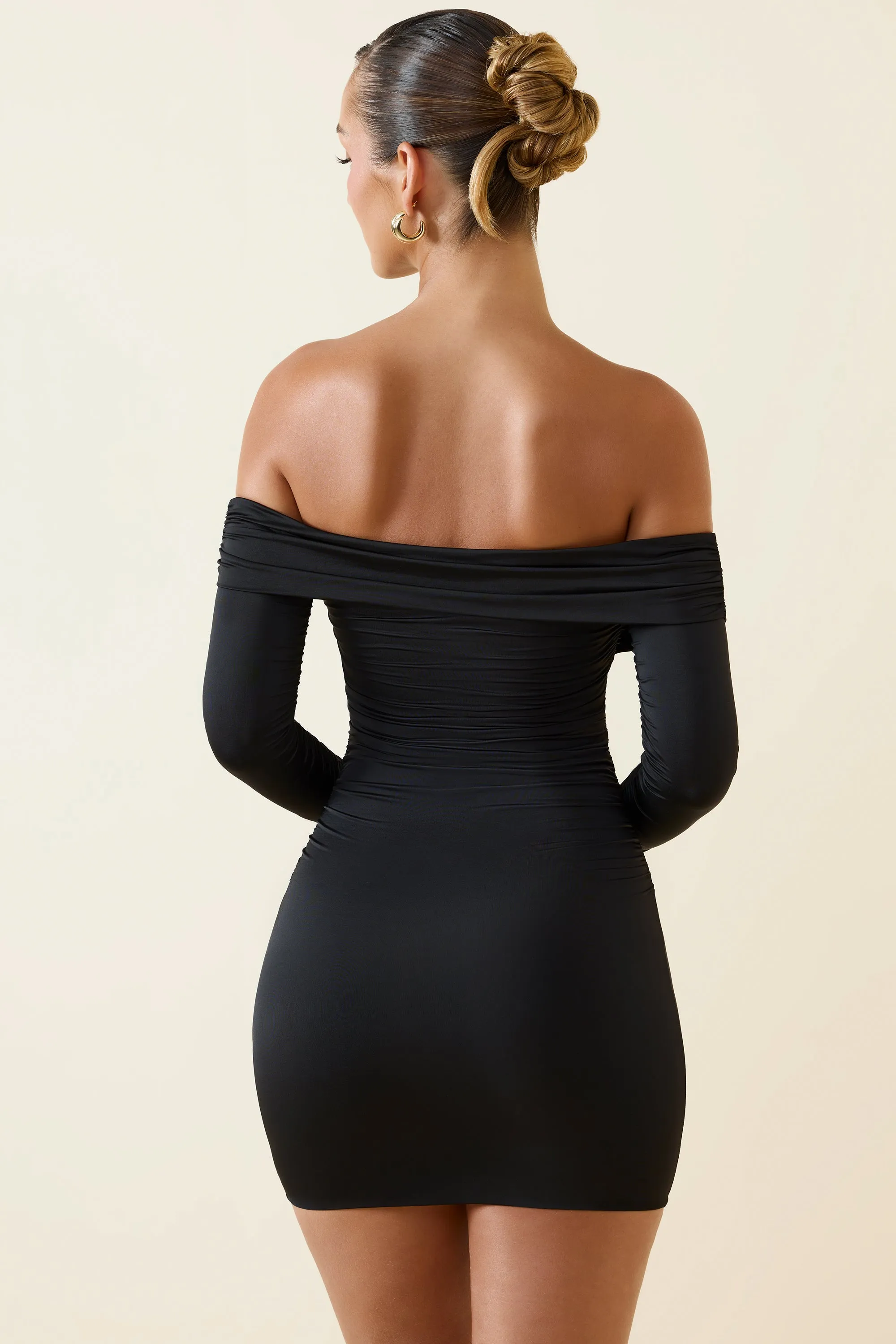 Off-Shoulder Ruched Bodycon Mini Dress in Black sold by Oh Polly product image thumbnail 2