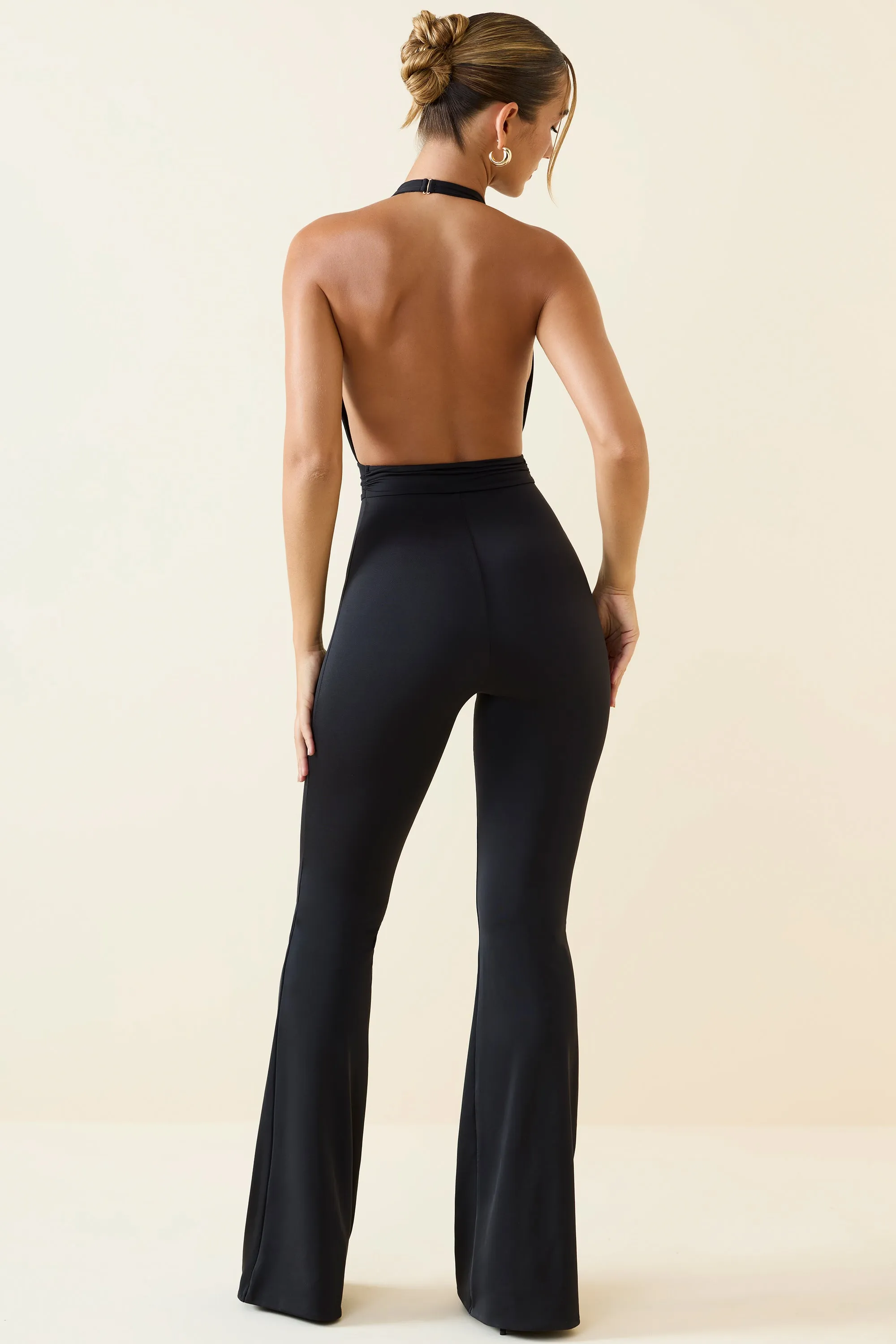 Halterneck Cut-Out Flared Jumpsuit in Black sold by Oh Polly product image thumbnail 2