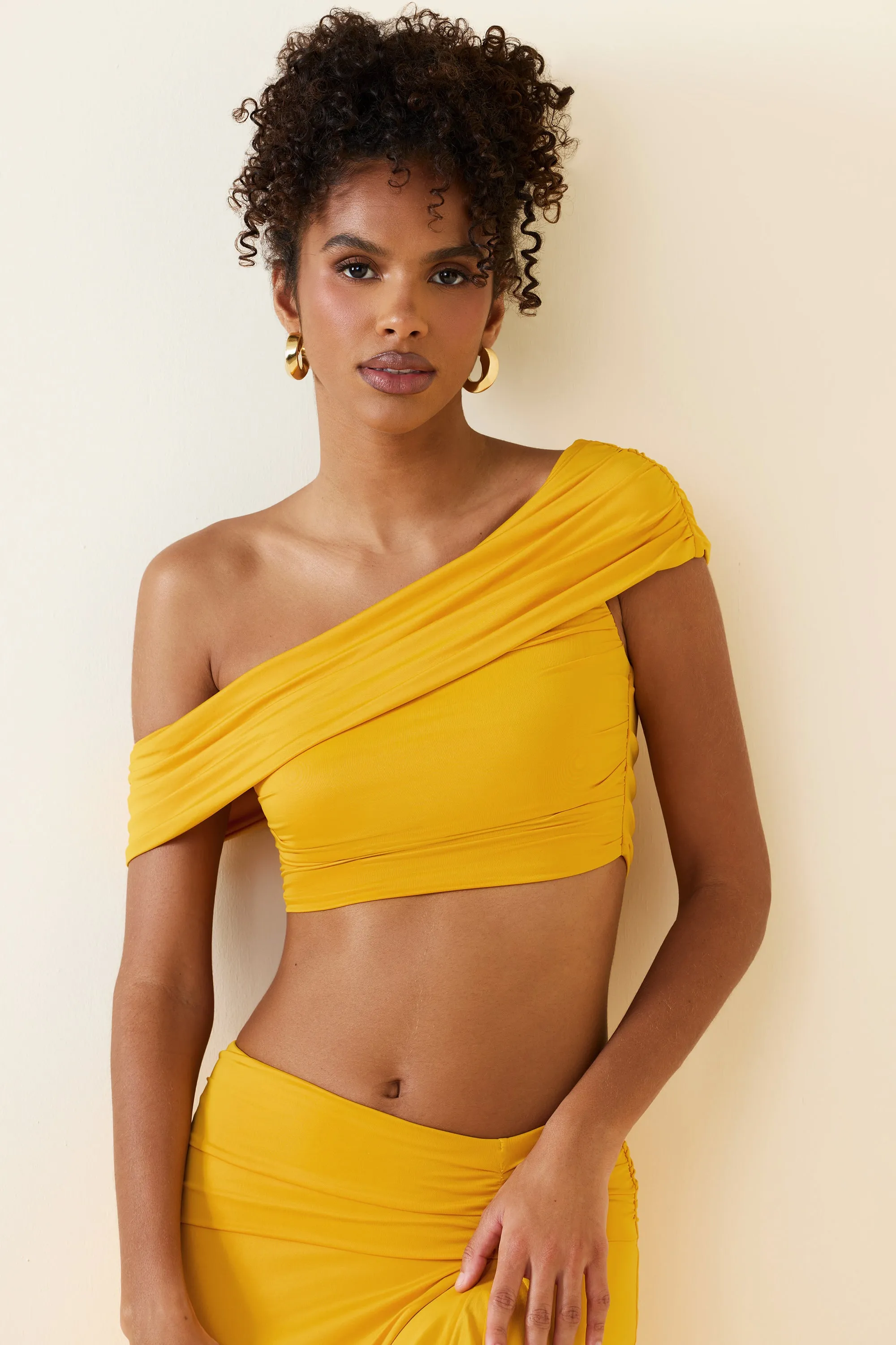 Asymmetric Ruched Off-Shoulder Crop Top in Golden Yellow sold by Oh Polly