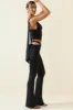 Petite Cut-Out Mid-Rise Flared Trousers in Black sold by Oh Polly