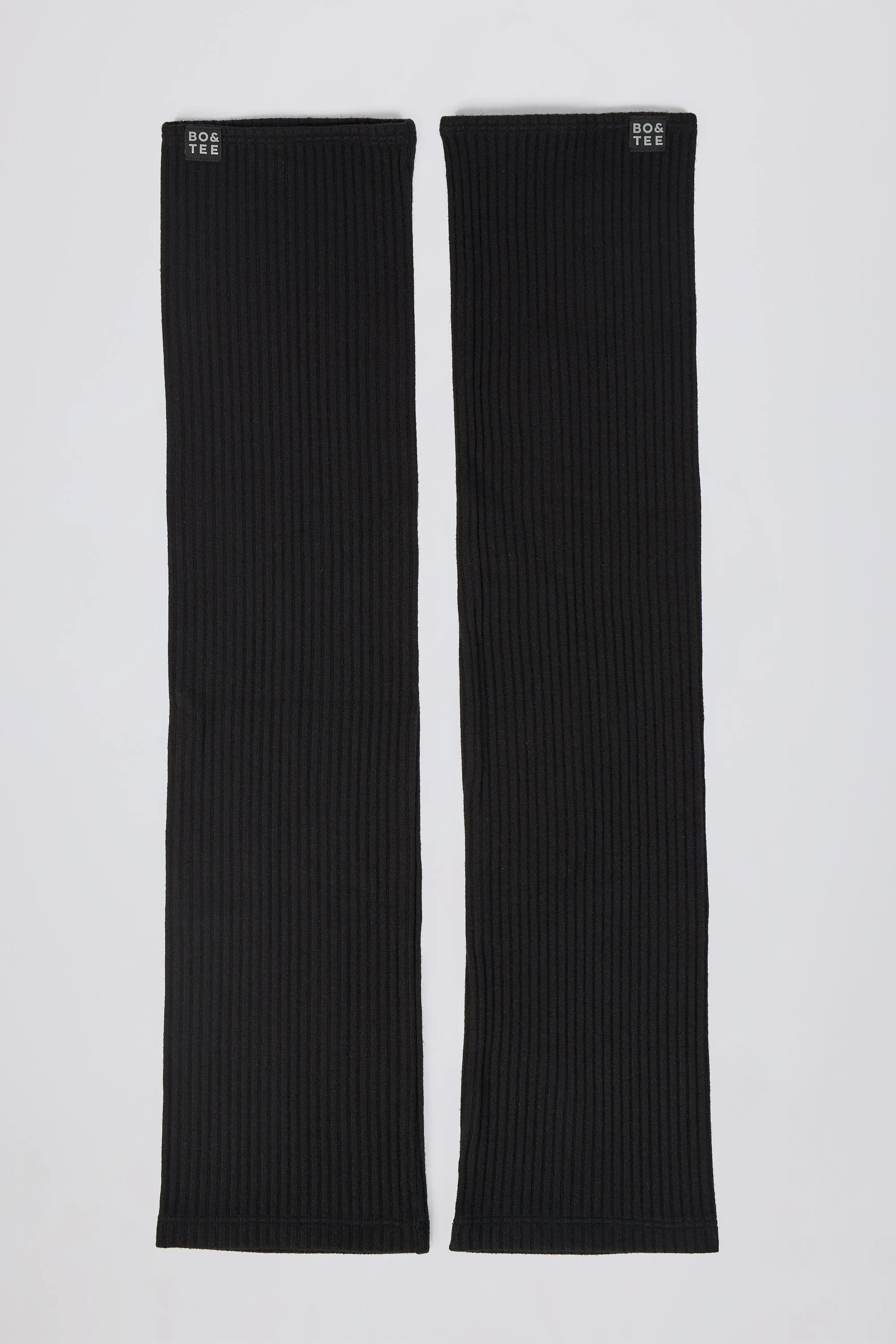 Leg Warmers in Black sold by Oh Polly