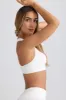 Super Sculpt Seamless T-Back Sports Bra in Eggshell sold by Oh Polly