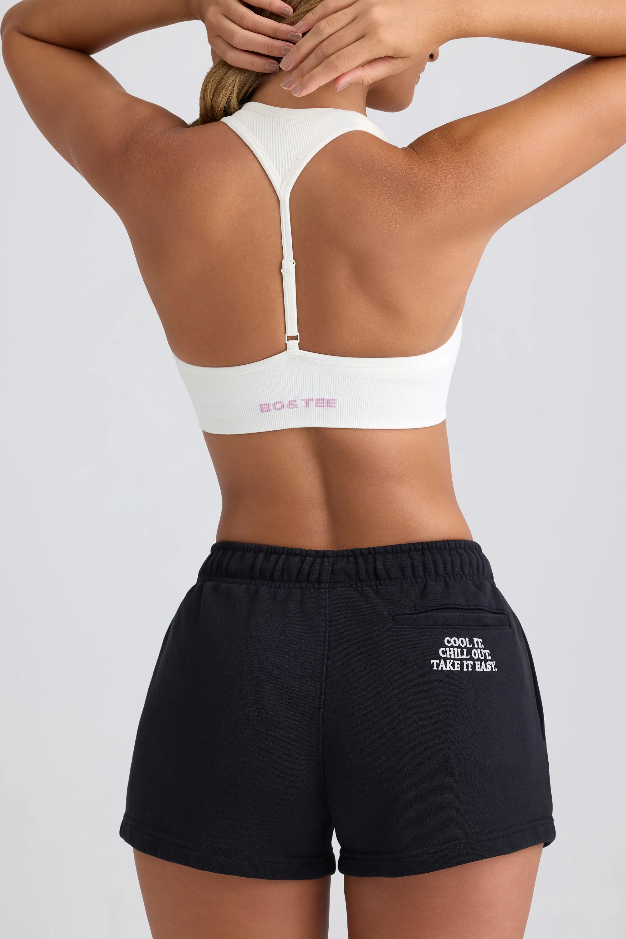 Mid-Rise Sweat Shorts in Black sold by Oh Polly