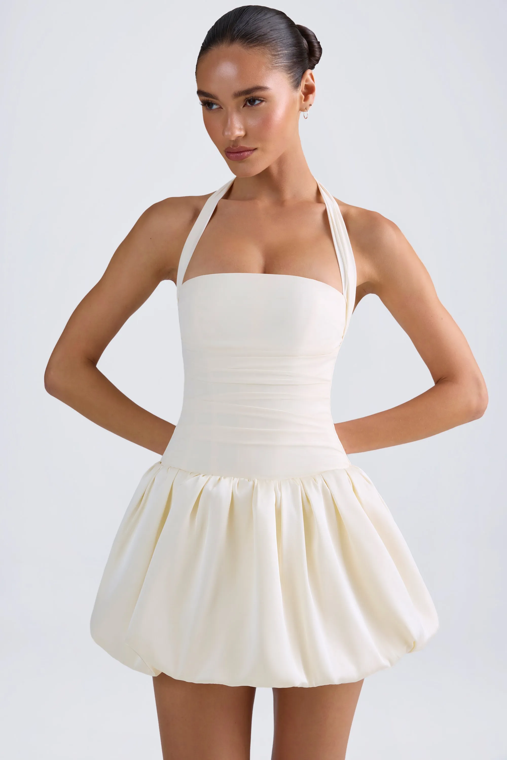 Halterneck Lace-Up Bubble Hem Corset Micro Mini Dress in Ivory sold by Oh Polly