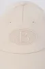Baseball Cap in Washed Cream sold by Oh Polly