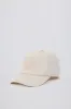 Baseball Cap in Washed Cream sold by Oh Polly