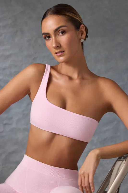 One-Shoulder Sports Bra in Washed Ice Pink sold by Oh Polly
