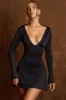 Open-Back Draped A-Line Mini Dress in Black sold by Oh Polly