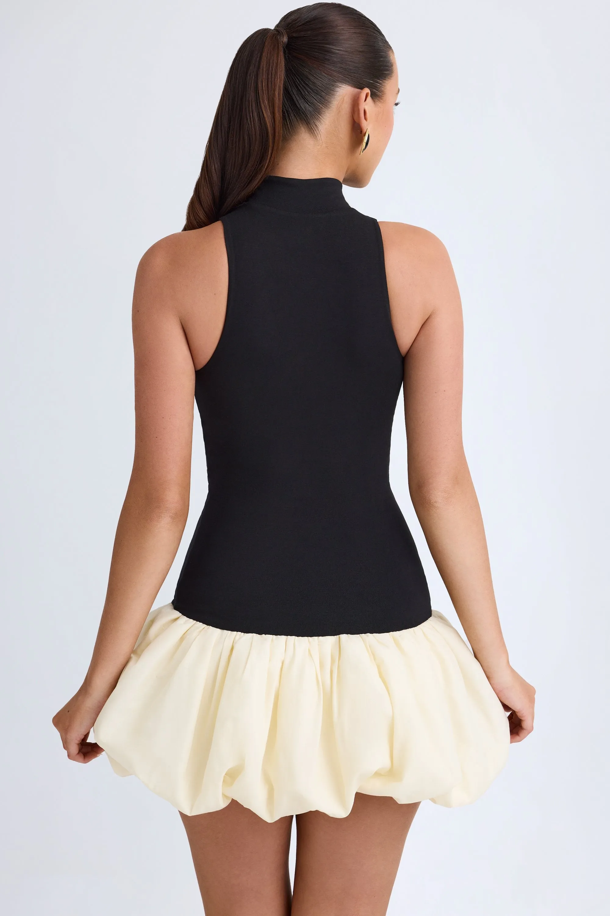 Turtleneck Drop-Waist Bubble Hem Mini Dress in Black sold by Oh Polly product image thumbnail 3
