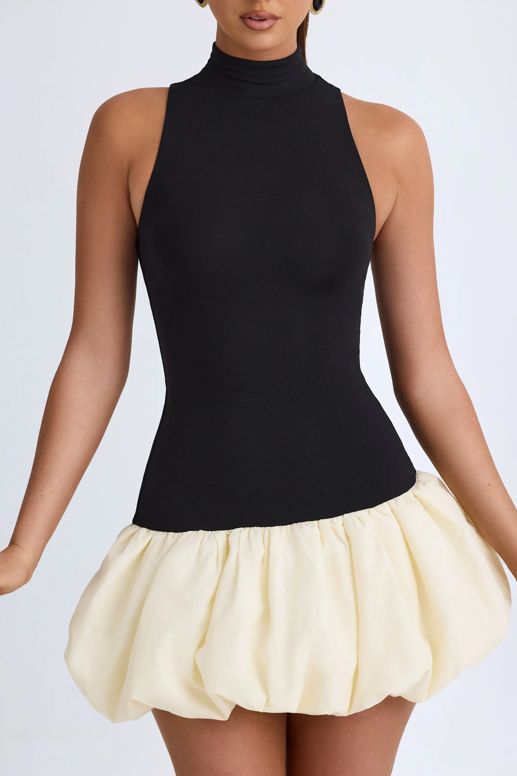 Turtleneck Drop-Waist Bubble Hem Mini Dress in Black sold by Oh Polly product image thumbnail 5