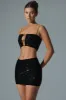 Embellished Mid-Rise Mini Skirt in Black sold by Oh Polly