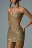 Embellished Cut-Out Mini Dress in Gold sold by Oh Polly