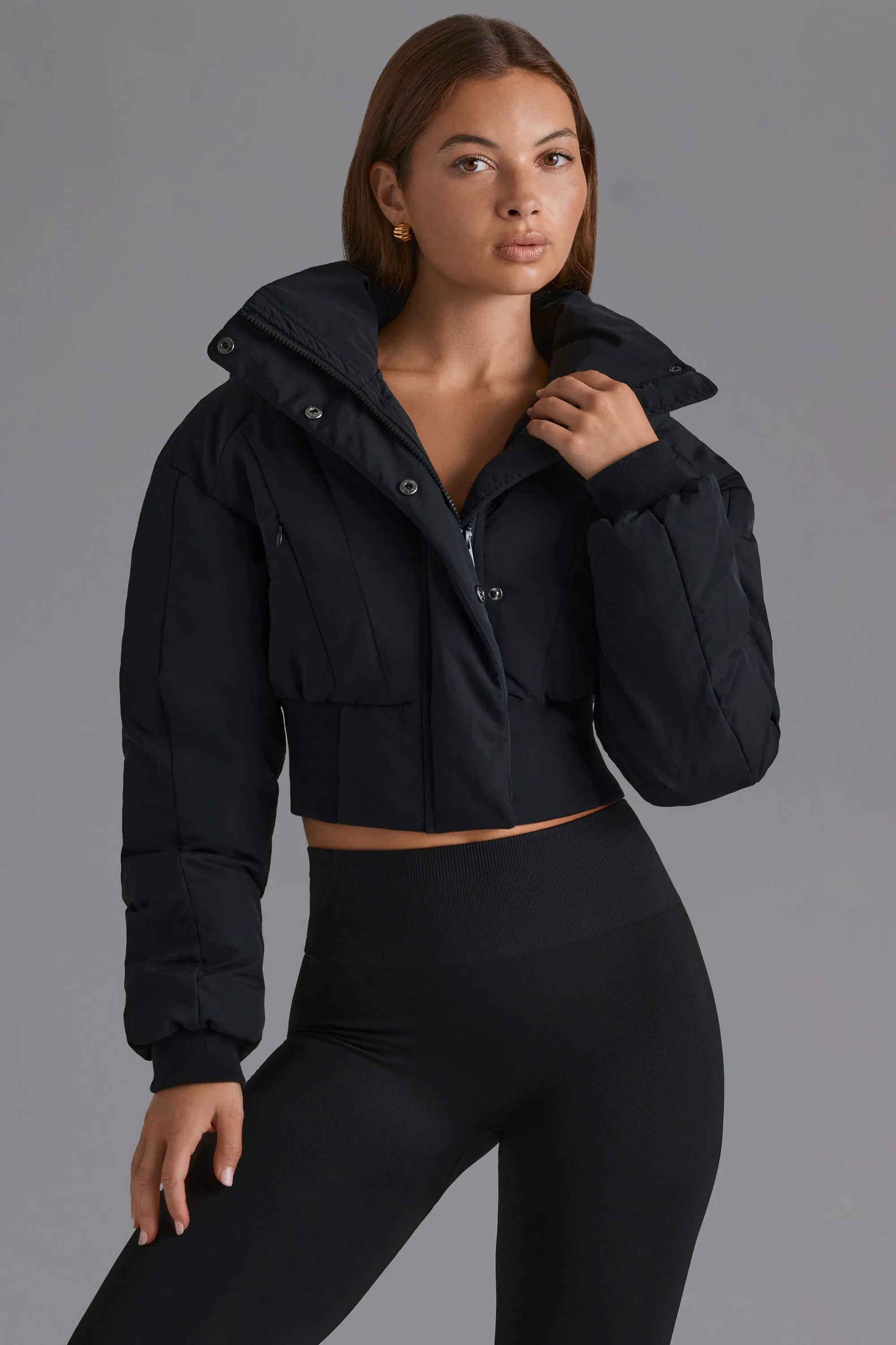 Contour Hooded Cropped Puffer Jacket in Black sold by Oh Polly