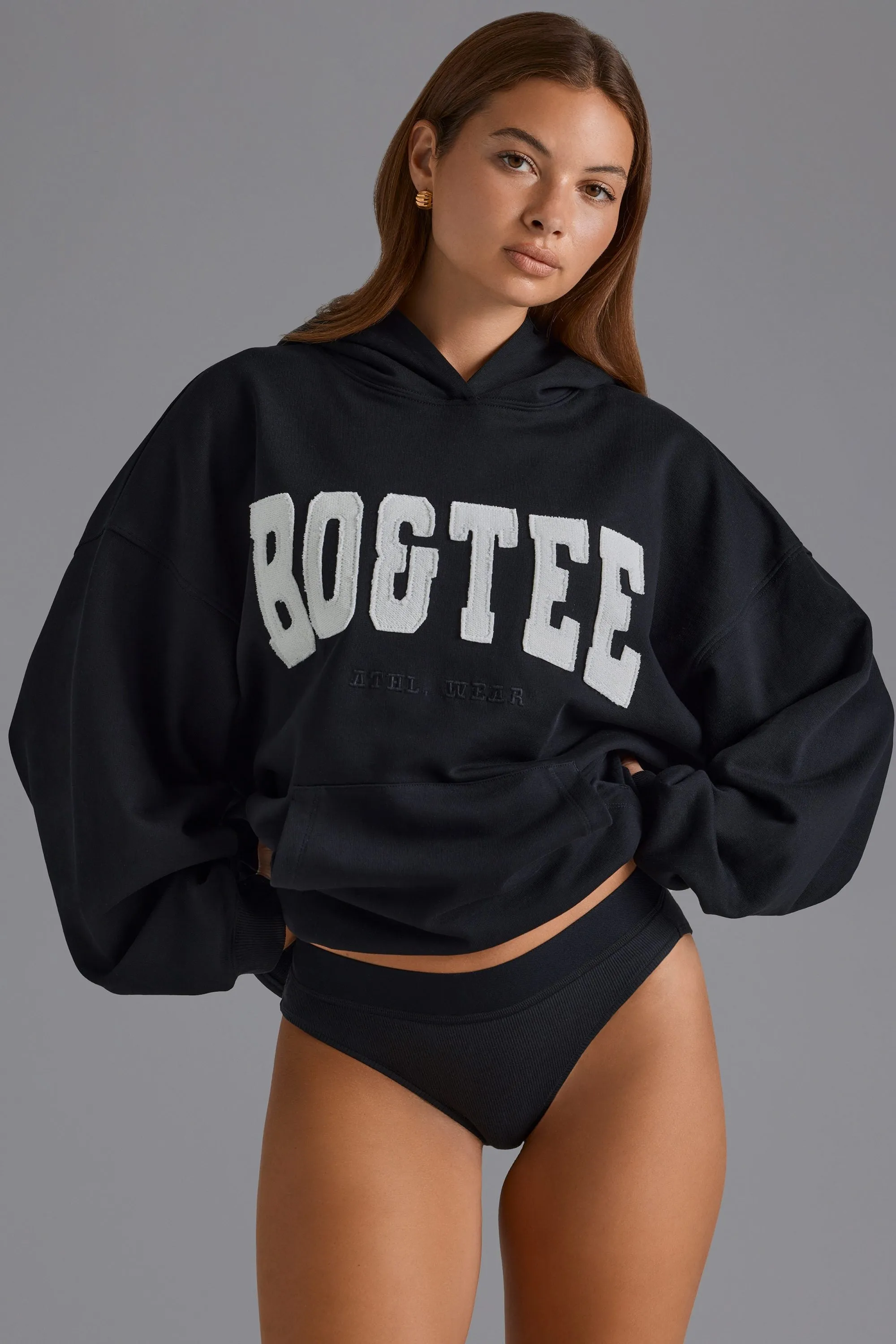 Cotton Fleece Appliqué Oversized Hoodie in Black sold by Oh Polly