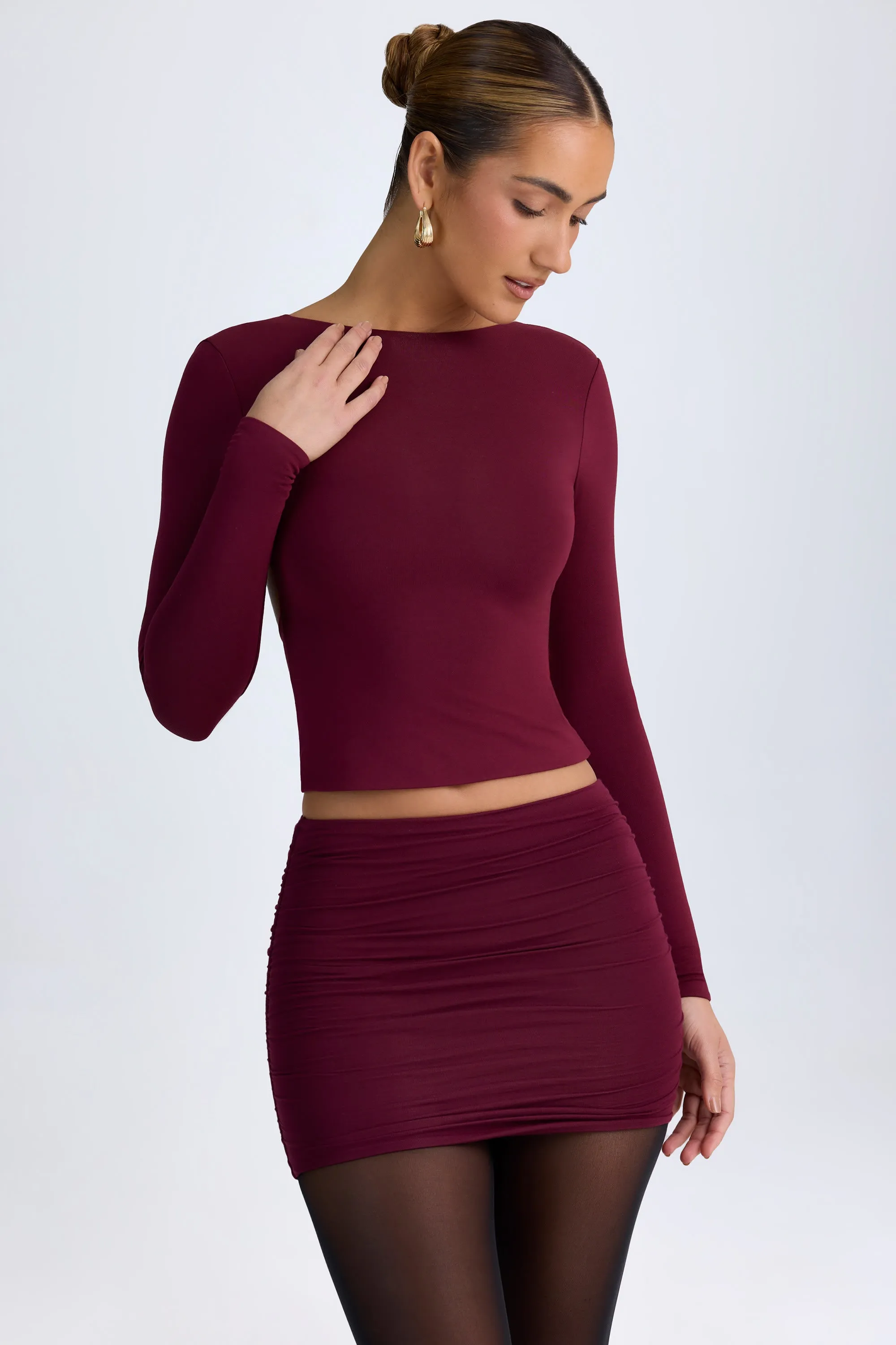 Modal High Neck Long Sleeve Open Back Top in Wine Red sold by Oh Polly
