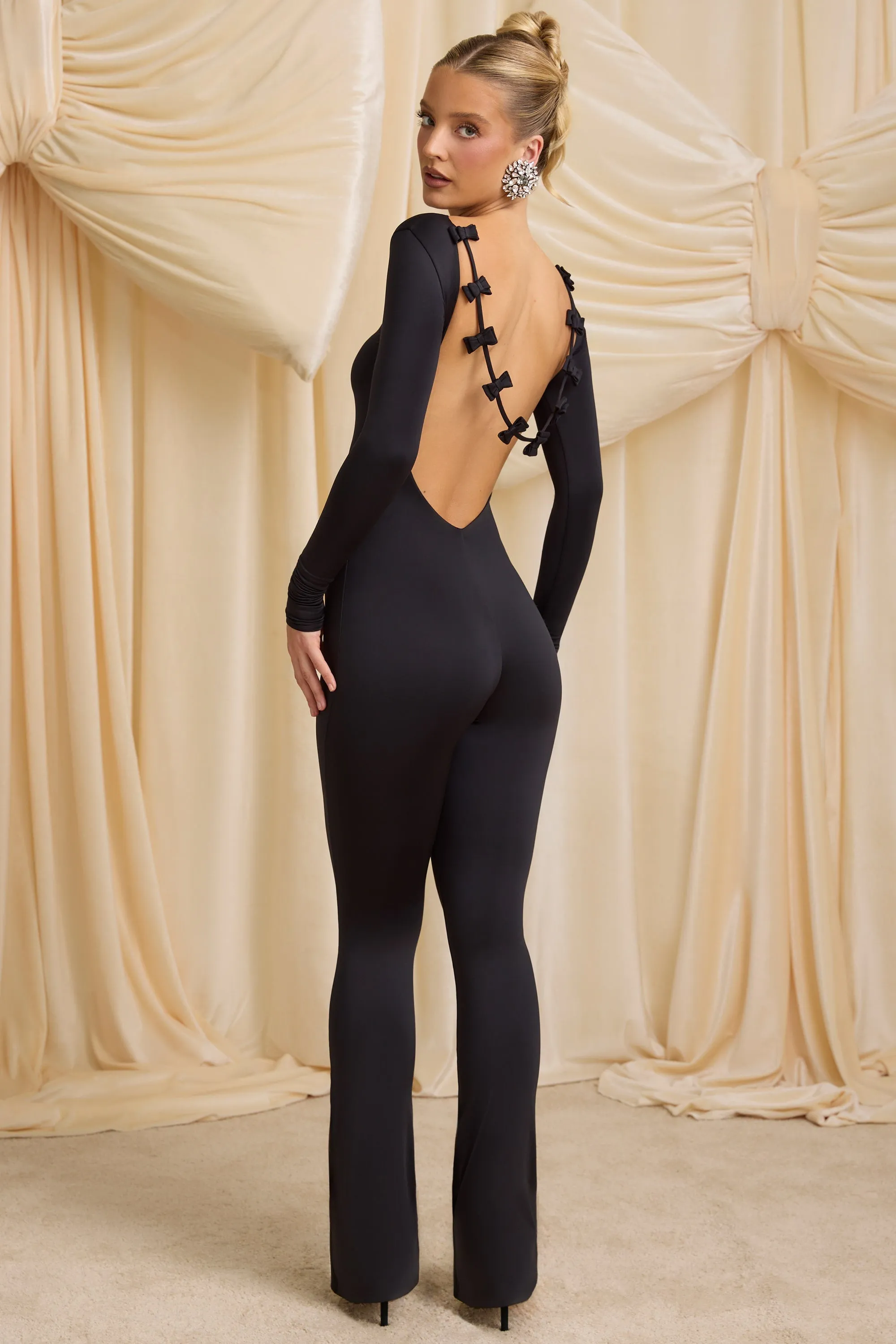 Petite Slinky Jersey Bow-Detail Jumpsuit in Black sold by Oh Polly