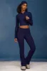 Cable-Knit Flared Trousers in Navy sold by Oh Polly