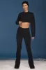 Cable-Knit Flared Trousers in Black sold by Oh Polly