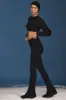 Cable-Knit Flared Trousers in Black sold by Oh Polly
