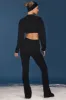 Cable-Knit Flared Trousers in Black sold by Oh Polly