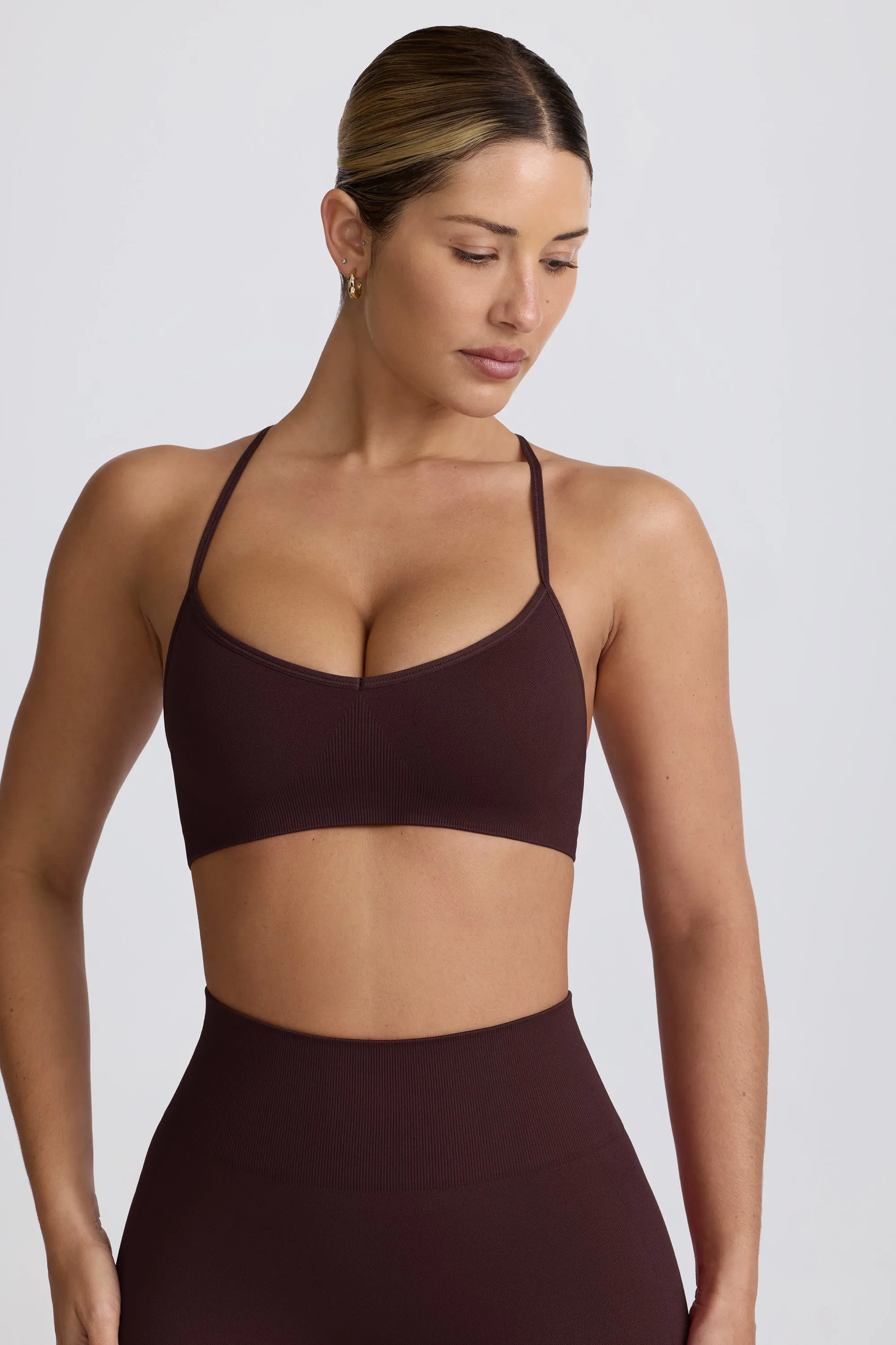 Super Sculpt Seamless Cross-Back Sports Bra in Chocolate sold by Oh Polly