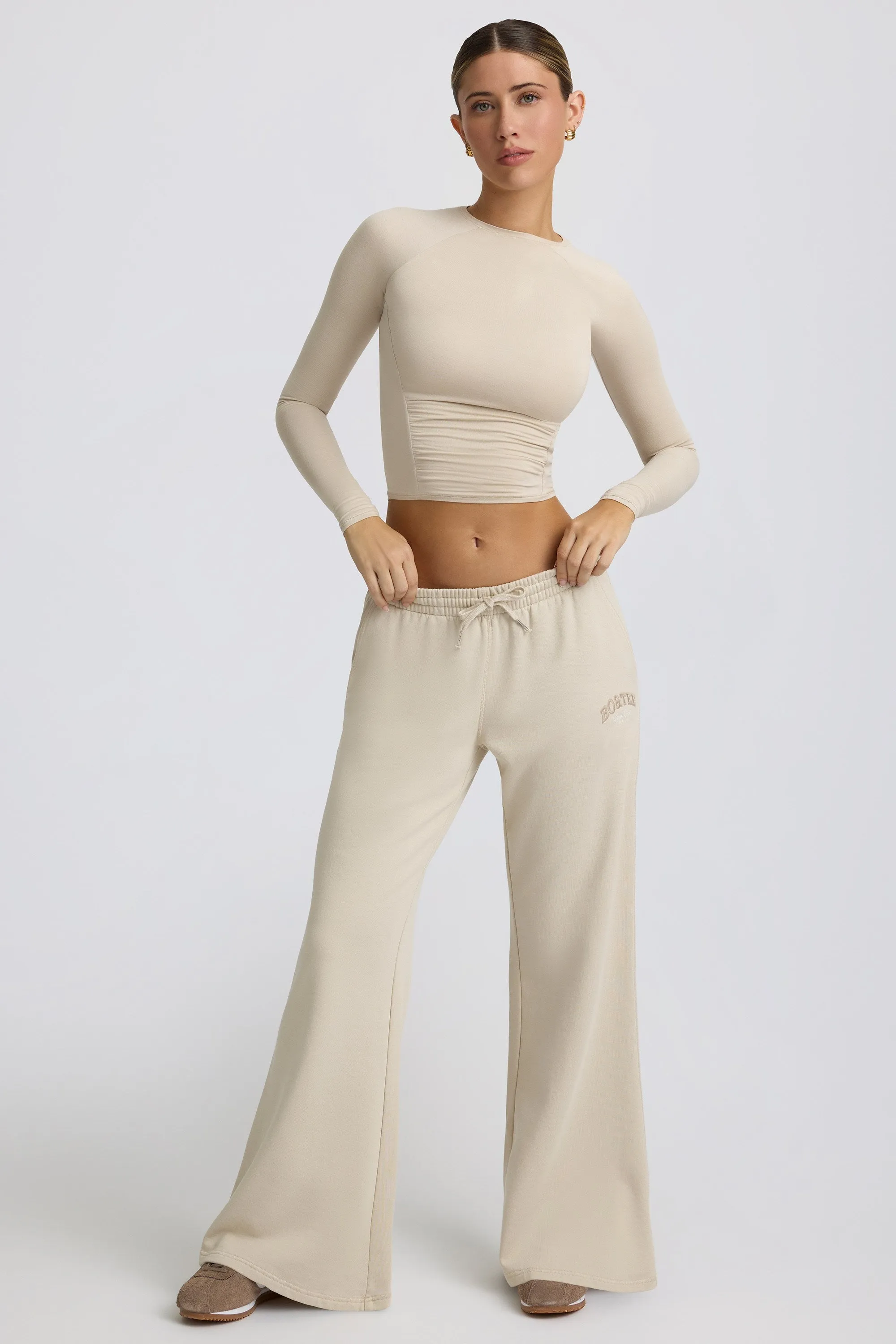 Low-Rise Wide-Leg Joggers in Bone sold by Oh Polly