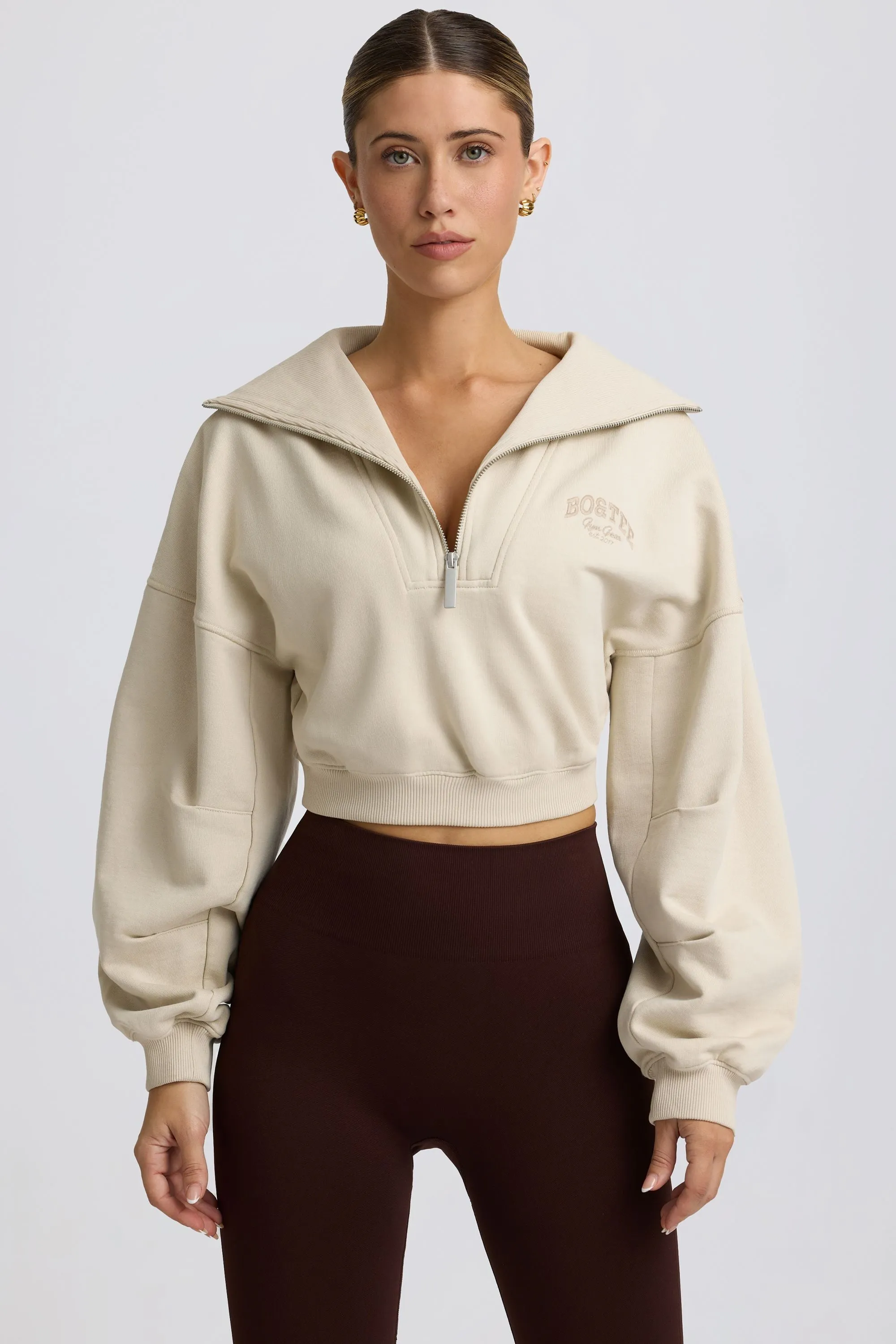 Quarter-Zip Cropped Sweatshirt in Bone sold by Oh Polly