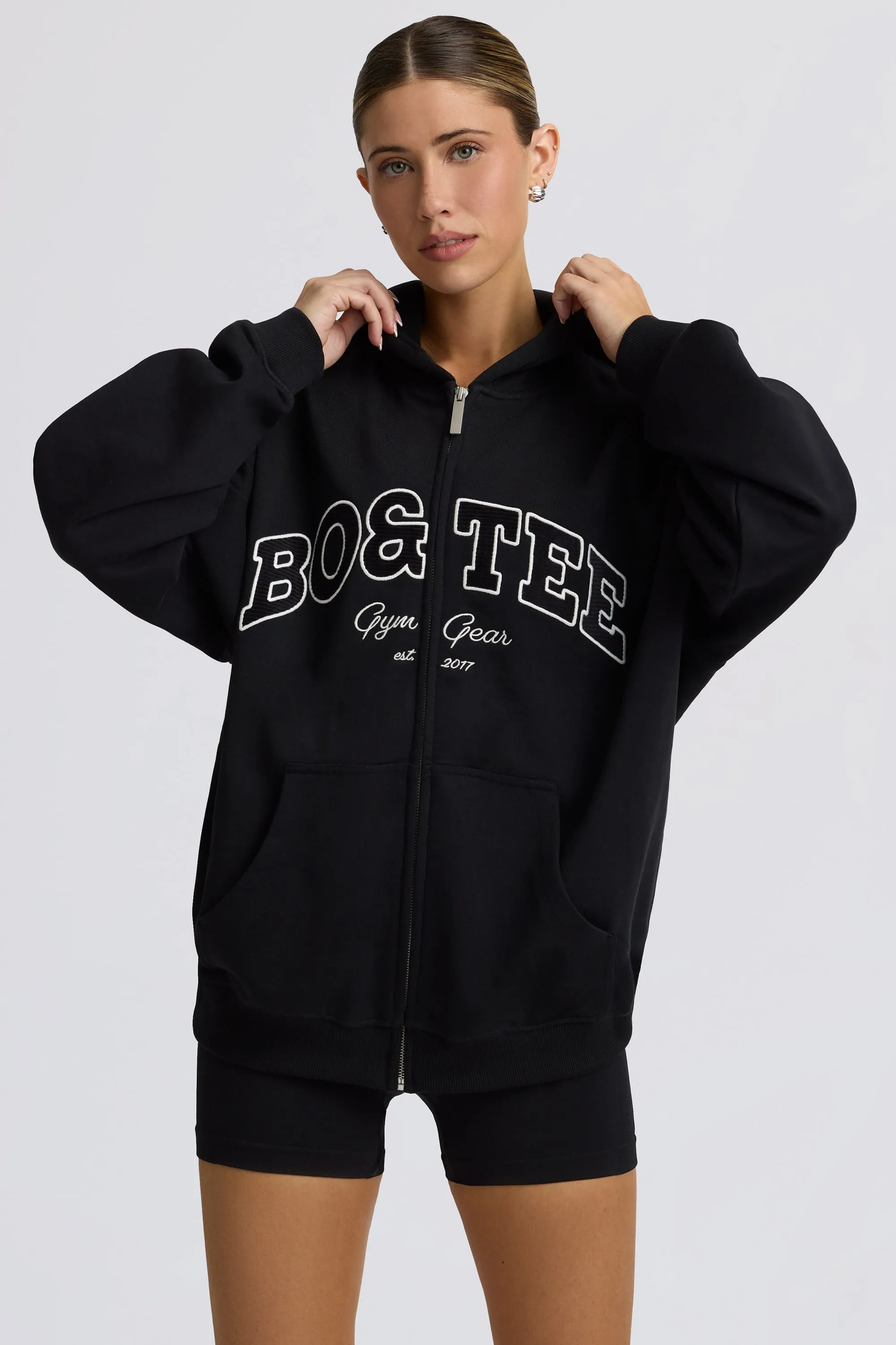 Oversized Zip-Up Hoodie in Black sold by Oh Polly