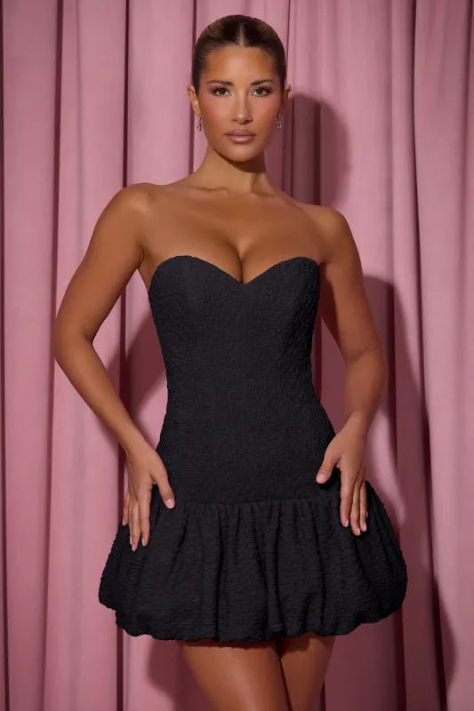 Cut-Out Bubble Hem Corset Mini Dress in Black sold by Oh Polly