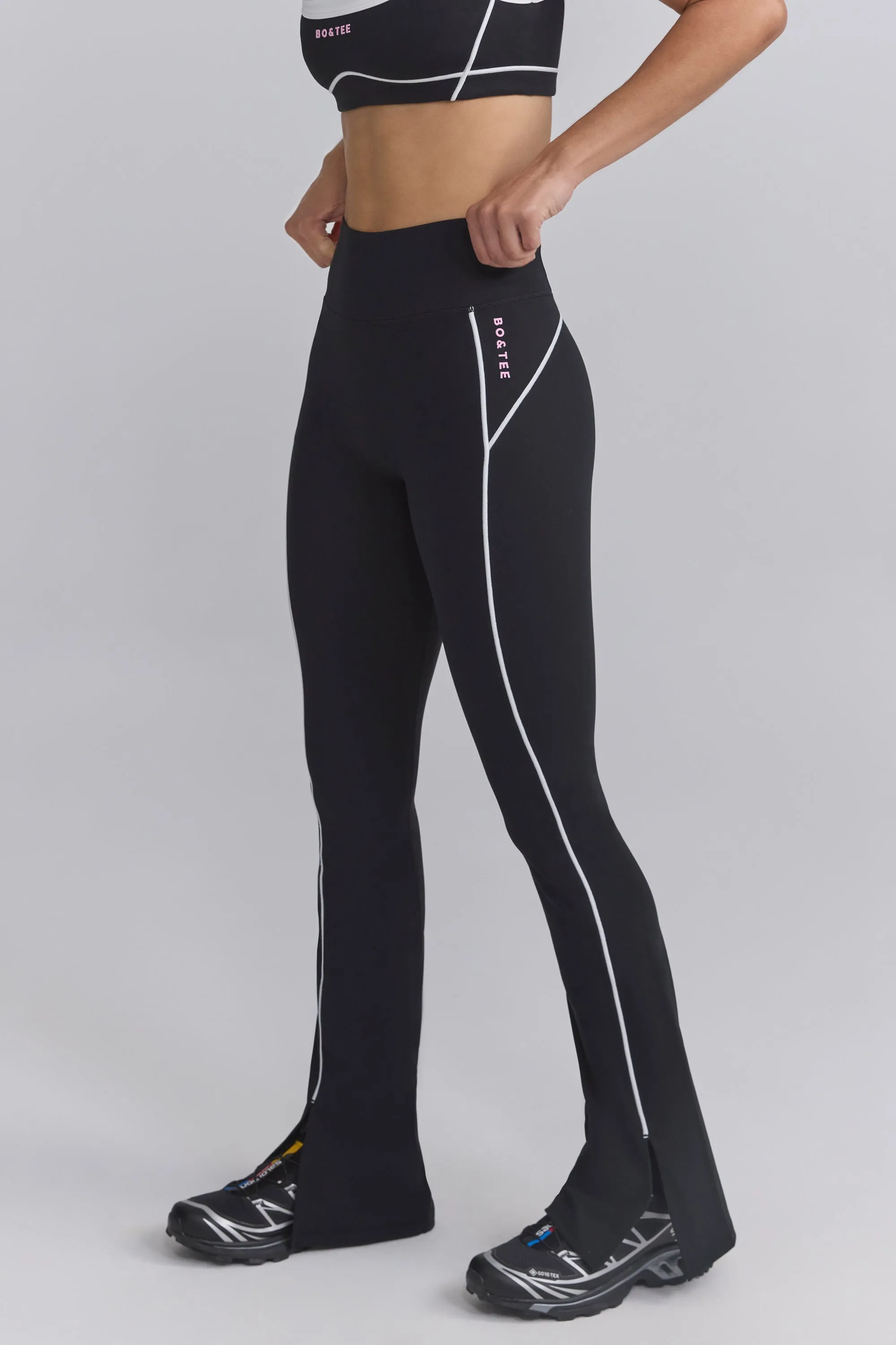 Soft Active Contrast-Trim Flared Trousers in Black sold by Oh Polly