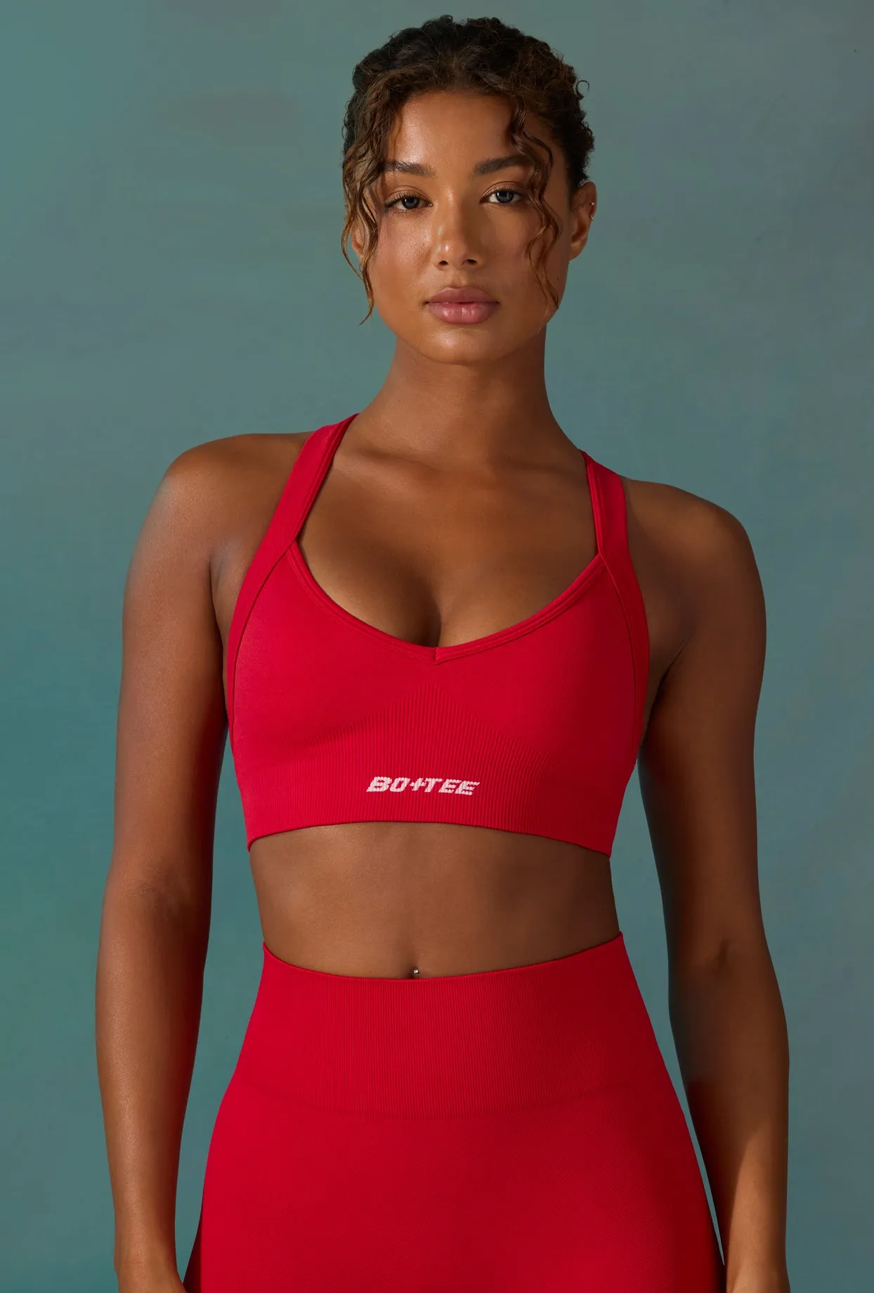 Super Sculpt Seamless Cross-Back Sports Bra in Tango Red sold by Oh Polly product image thumbnail 5