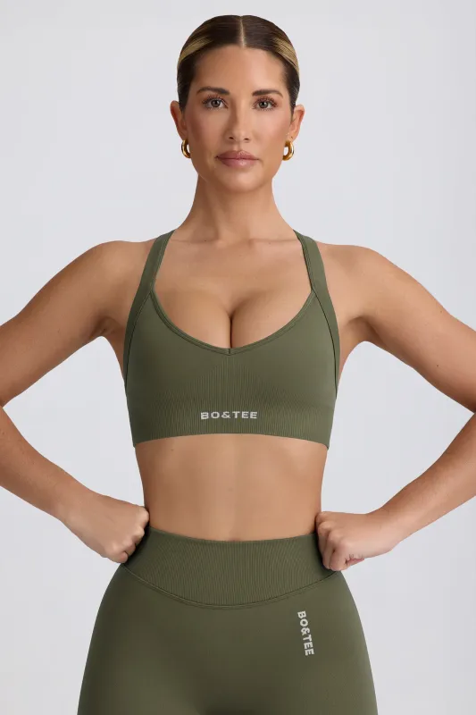 Super Sculpt Seamless Cross-Back Sports Bra in Light Green sold by Oh Polly