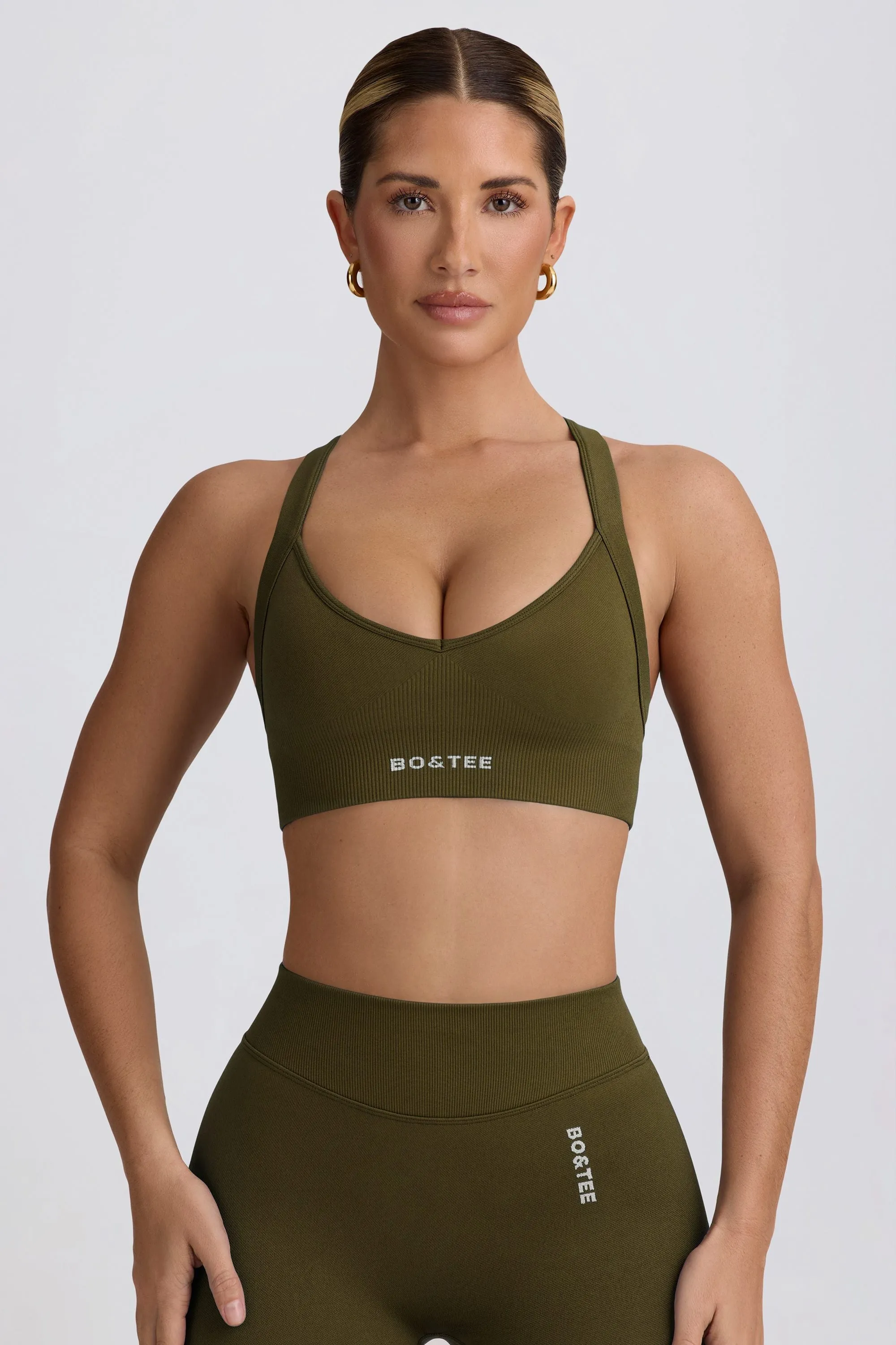 Super Sculpt Seamless Cross-Back Sports Bra in Dark Green sold by Oh Polly product image thumbnail 5