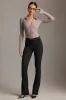 Low-Rise Flared Trousers in Black sold by Oh Polly