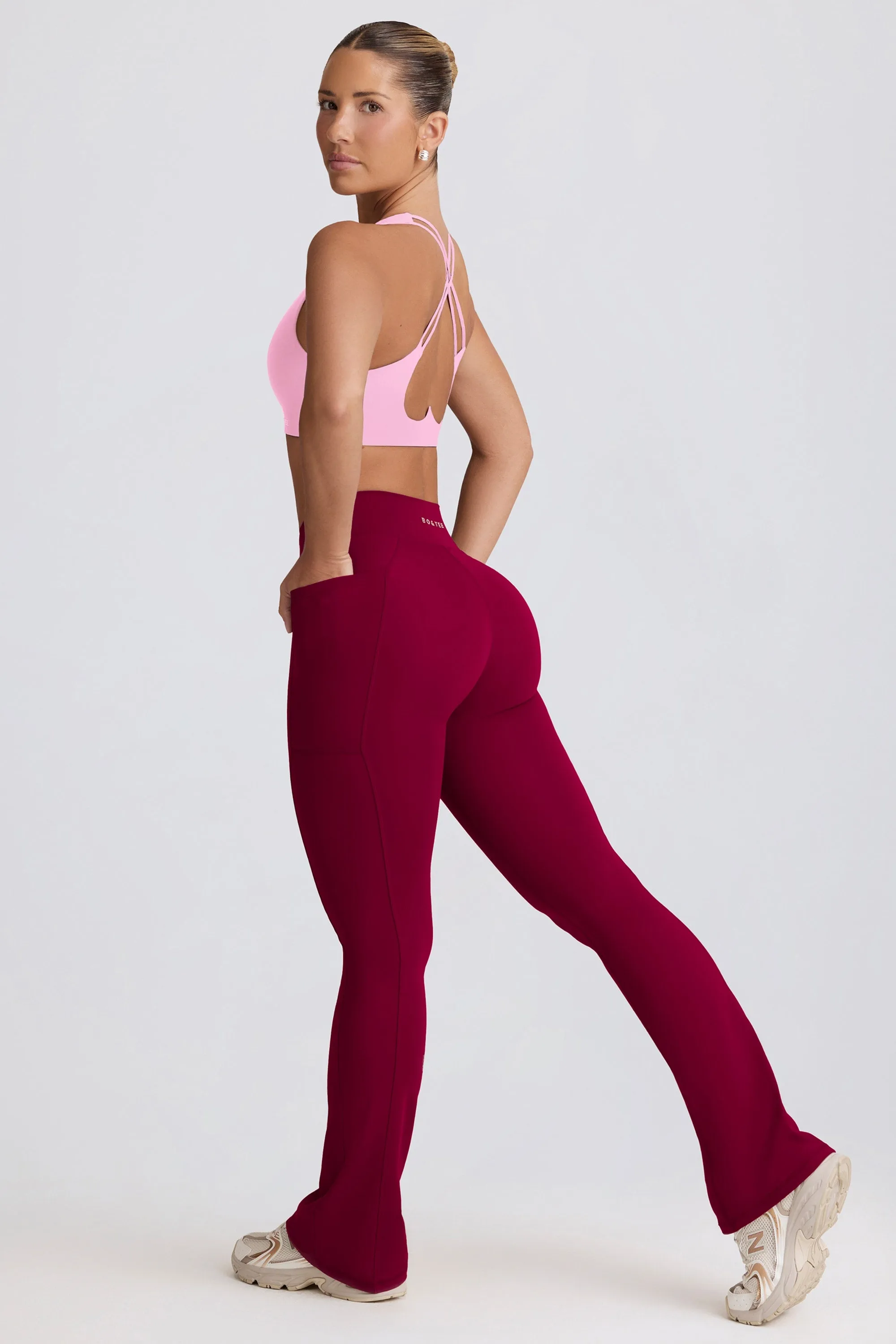 Soft Active V-Waist Pocket Flared Leggings in Burgundy sold by Oh Polly