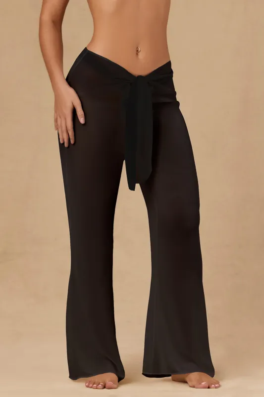 Tie-Front Wide-Leg Trousers in Black sold by Oh Polly
