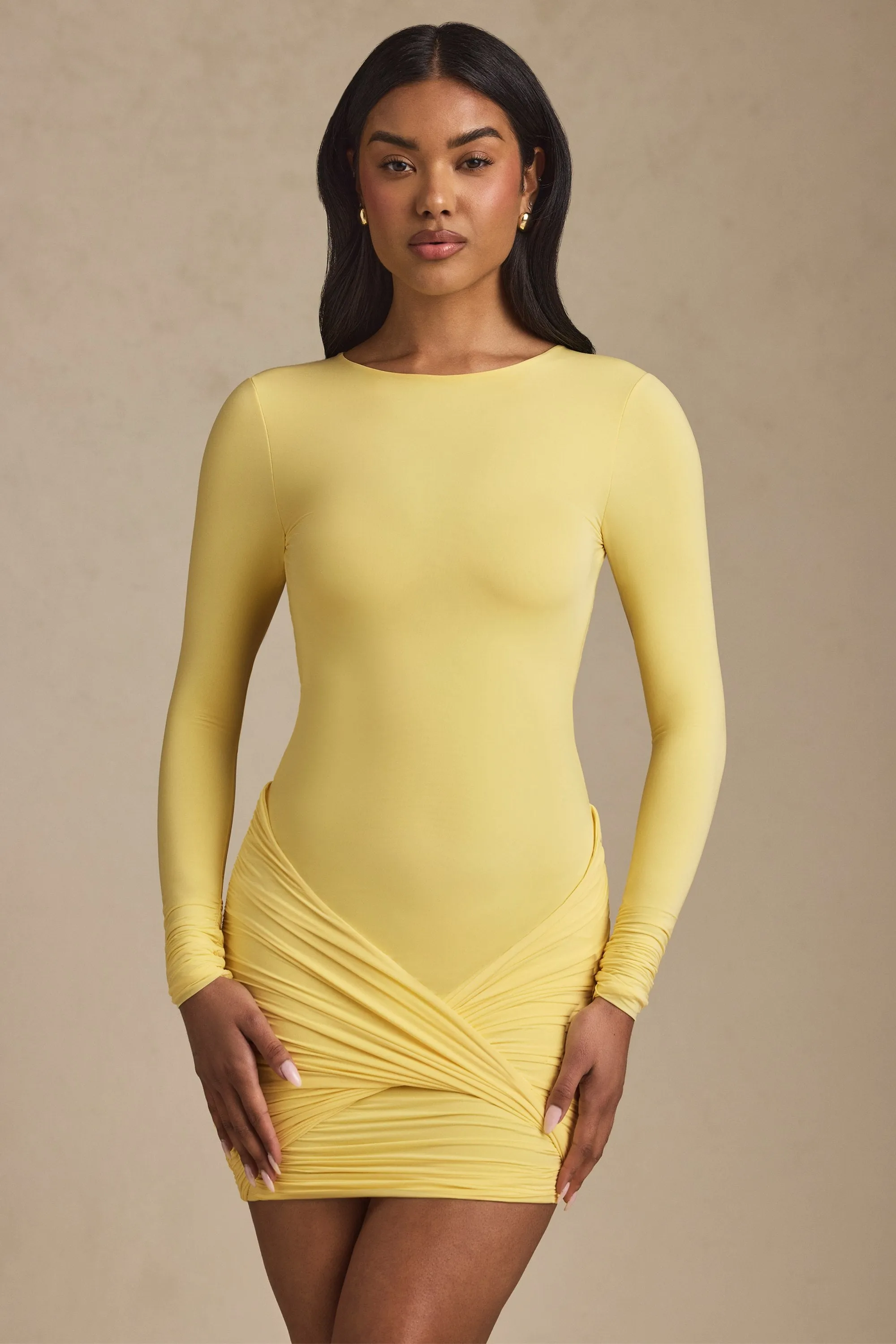 Twist-Front Ruched Backless Mini Dress in Pastel Yellow sold by Oh Polly