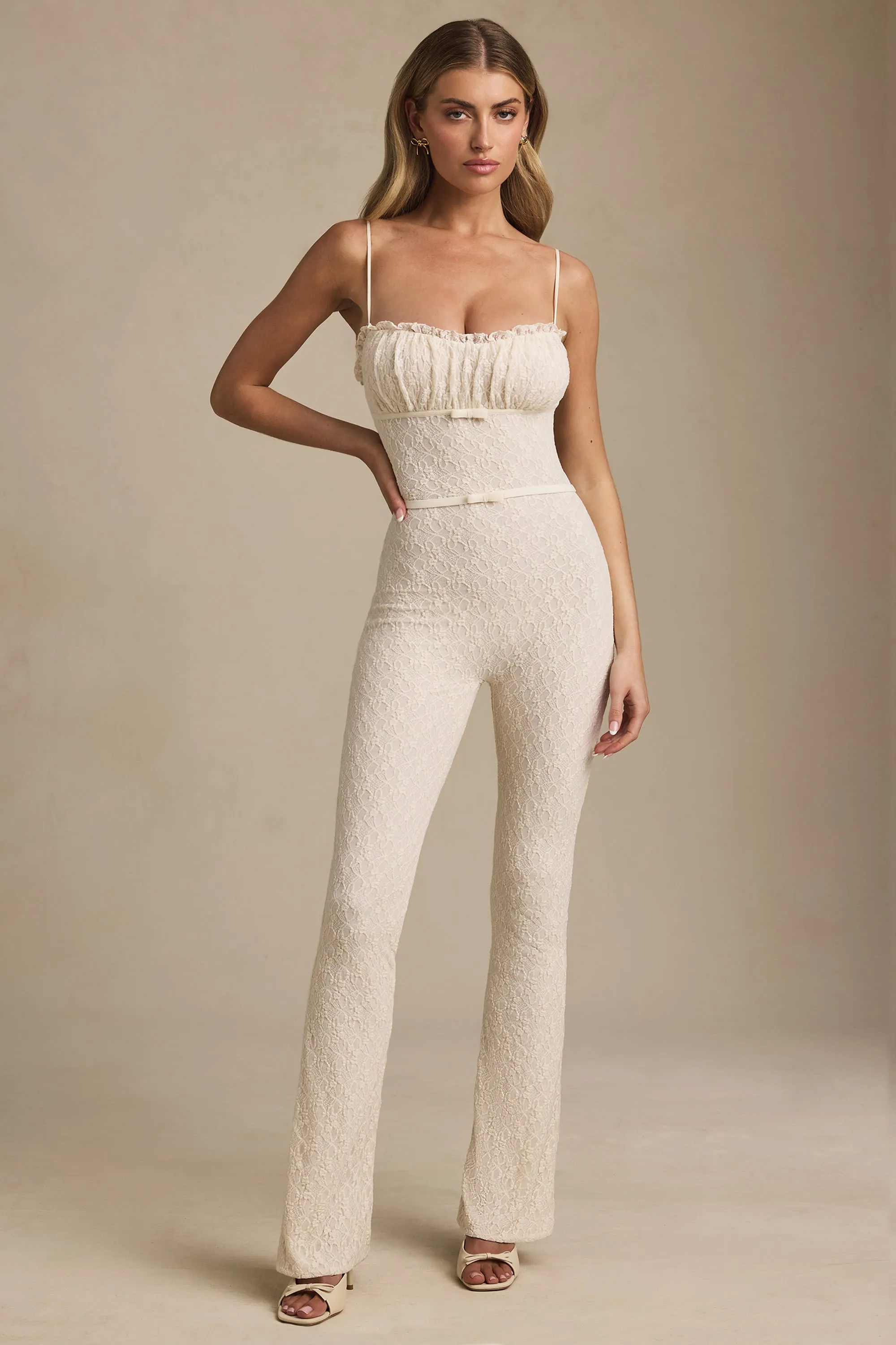 Bow-Detail Lace Flared Jumpsuit in Ivory sold by Oh Polly