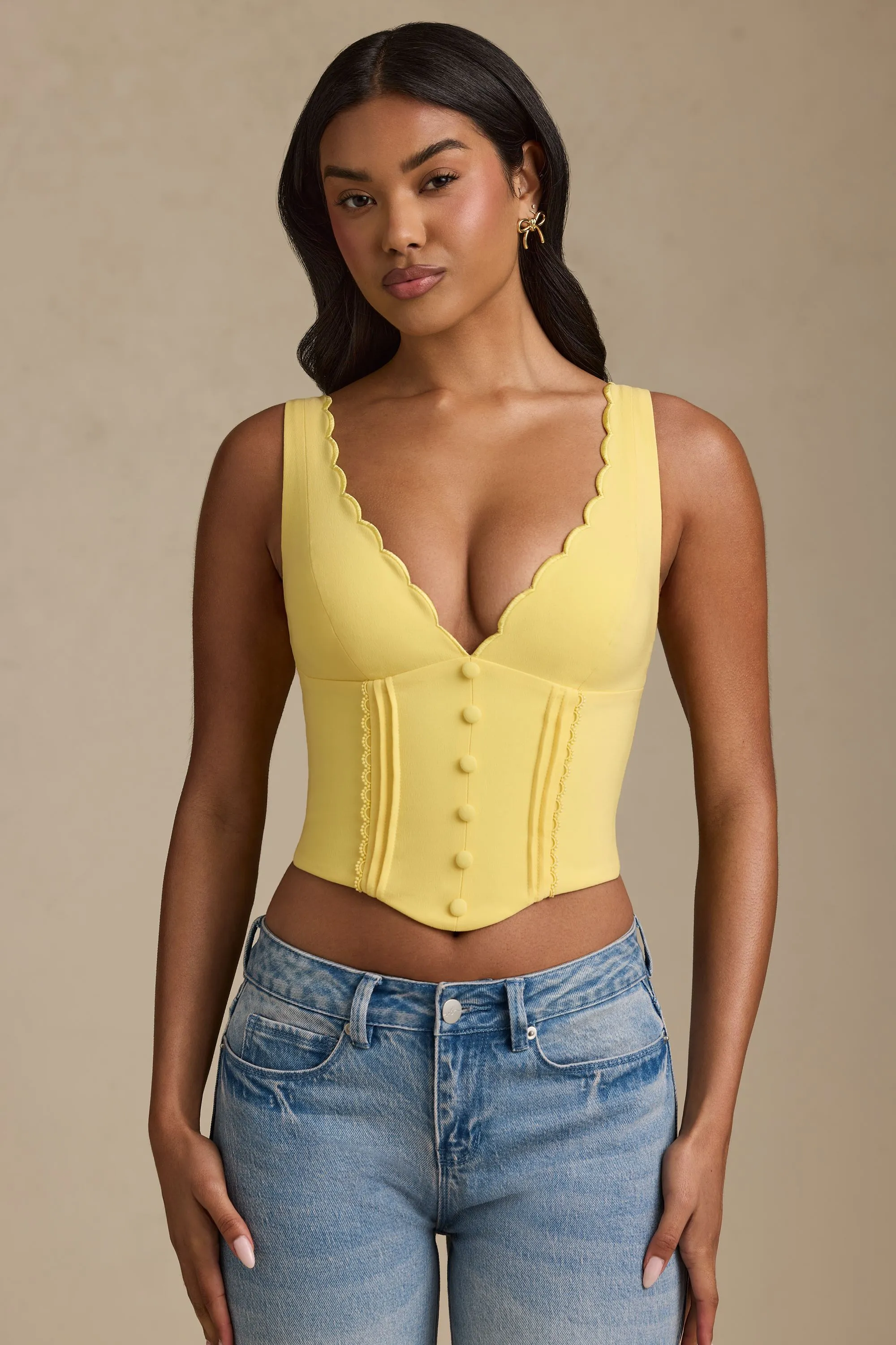 Plunge-Neck Scalloped Corset Top in Pastel Yellow sold by Oh Polly
