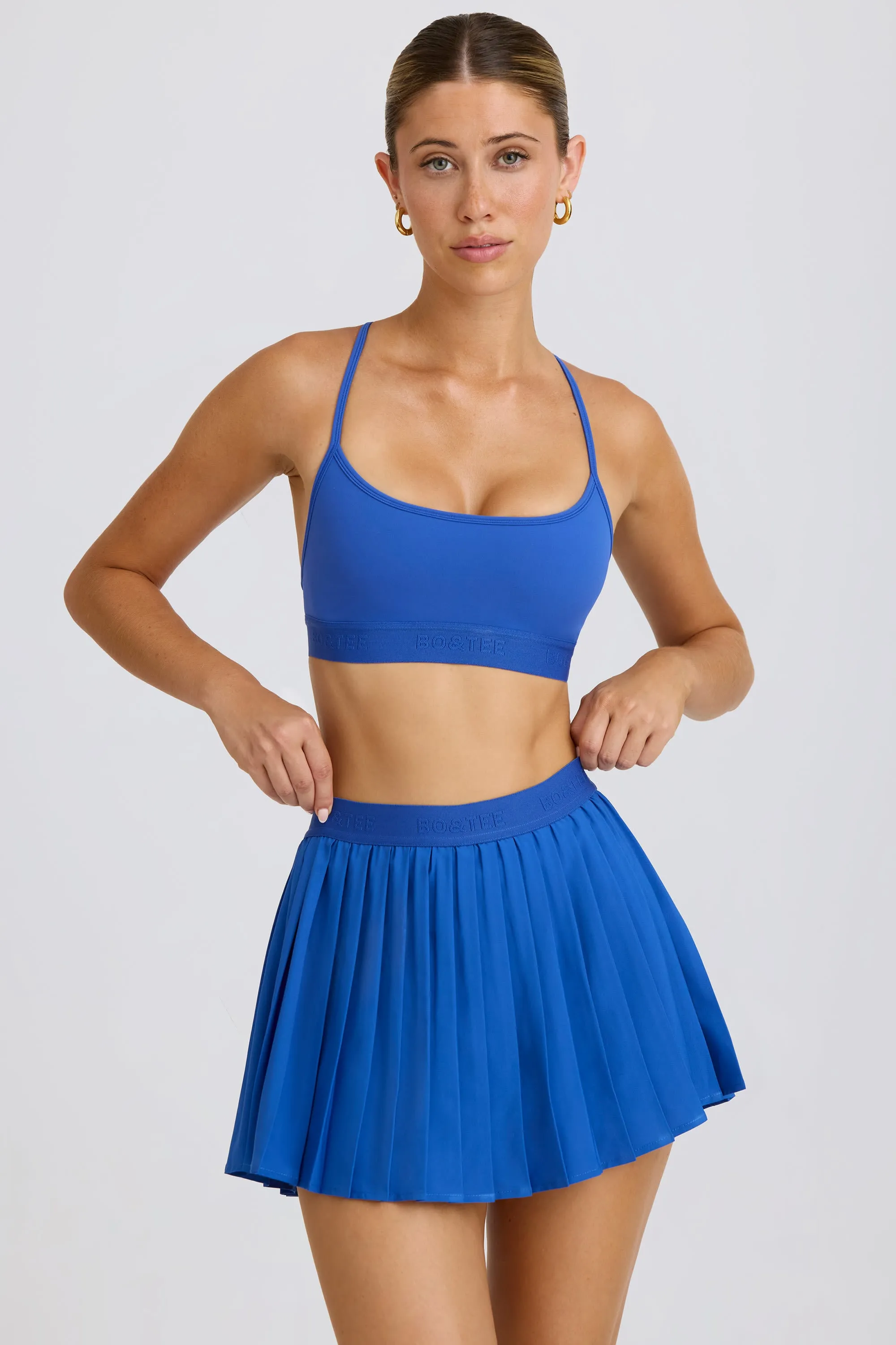 Pleated Tennis Skirt in Cobalt sold by Oh Polly